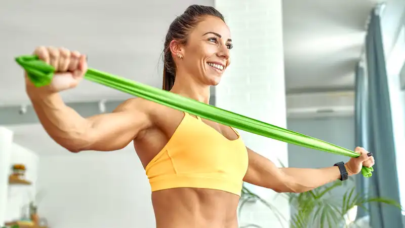 According to a Pilates instructor, this standing resistance band workout can work all major muscle groups in 25 minutes.