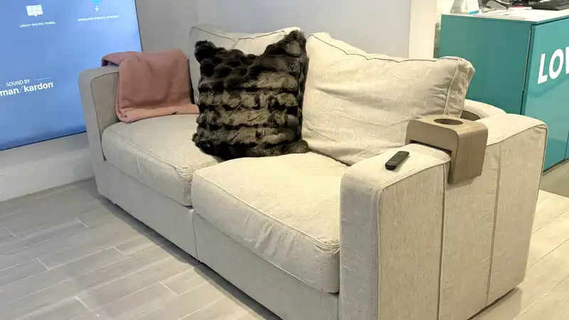 We tried an amazing smart couch with built-in surround sound and wireless charging